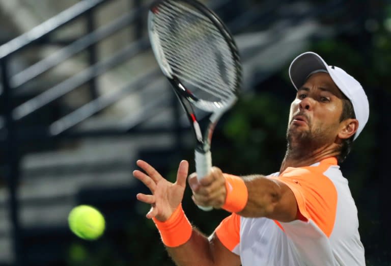 Spain's Fernando Verdasco returns the ball to Gael Monfils of France on March 2, 2017, in Dubai