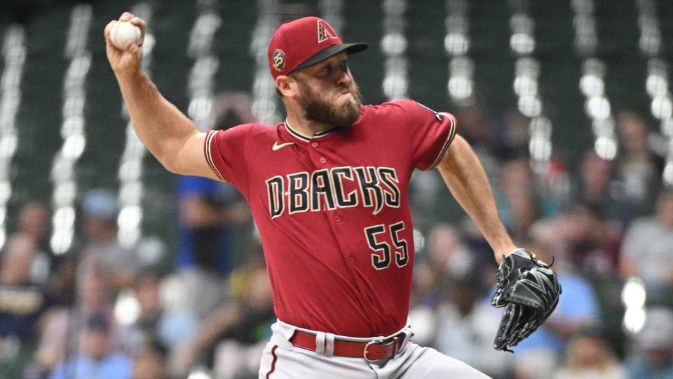 Arizona Diamondbacks relief pitcher Austin Adams (55) delivers a pitch against the Milwaukee Brewers in the sixth inning at American Family Field