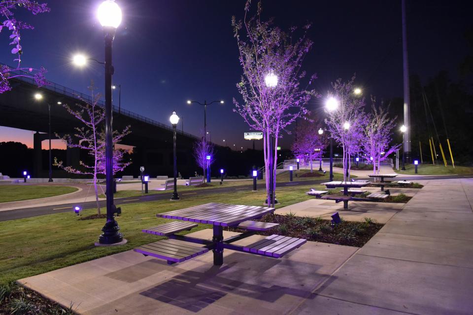 Sep 27, 2022; Tuscaloosa, Alabama, USA;  River District Park is open and is illuminated at night with a new lighting system that adds color to the Tuscaloosa river front area.