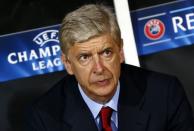 Arsenal's coach Arsene Wenger is pictured during the first leg of their Champions League qualifying soccer match against Besiktas at Ataturk Olympic stadium in Istanbul August 19, 2014. REUTERS/Murad Sezer