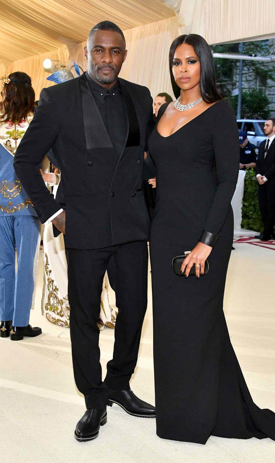 Idris Elba and Sabrina Dhowre attend the Heavenly Bodies: Fashion & The Catholic Imagination Costume Institute Gala at The Metropolitan Museum of Art on May 7, 2018 in New York City