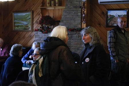 Anti-fracking activist Vera Scroggins (2nd R) speaks with a friend inside a restaurant in Montrose, Pennsylvania, March 24, 2014. REUTERS/Eduardo Munoz