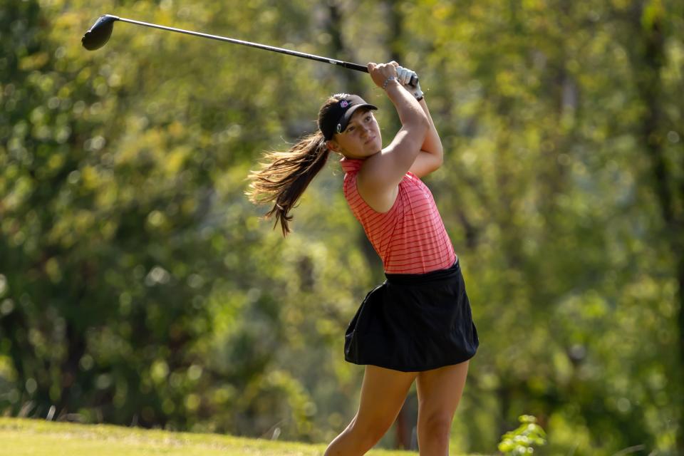 Moon Area junior Angelina Schild watches her ball's flight during the Tigers section match against Mt. Lebanon at Mount Lebanon Golf Course on Sept. 10.