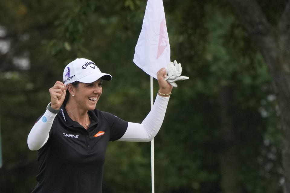 Emma Talley reacts after picking up her ball in the 16th green cup for an eagle during the final round of the Dow Great Lakes Bay Invitational golf tournament at Midland Country Club, Saturday, July 22, 2023, in Midland, Mich. (AP Photo/Carlos Osorio)