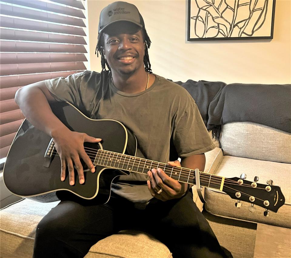 NFL running back Godwin Igwebuike is also a musician who released a Christian single called "Long Nights. The Pickerington native is shown in his Columbus residence in this March 17, 2023, photo.