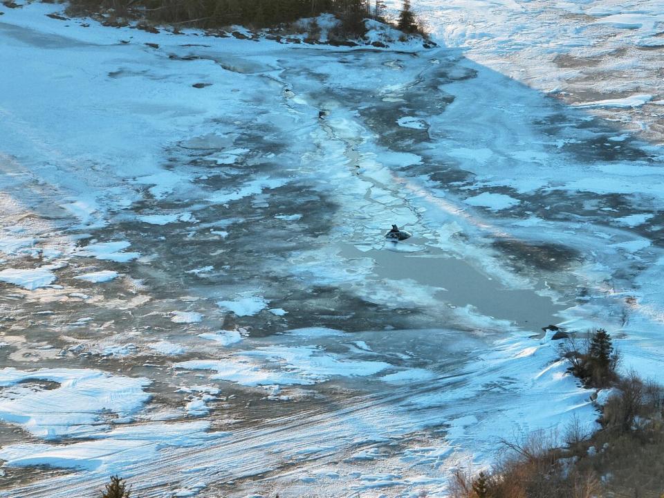 La Ronge RCMP detachment found the woman and her dog in a remote area of the lake by using a drone. 