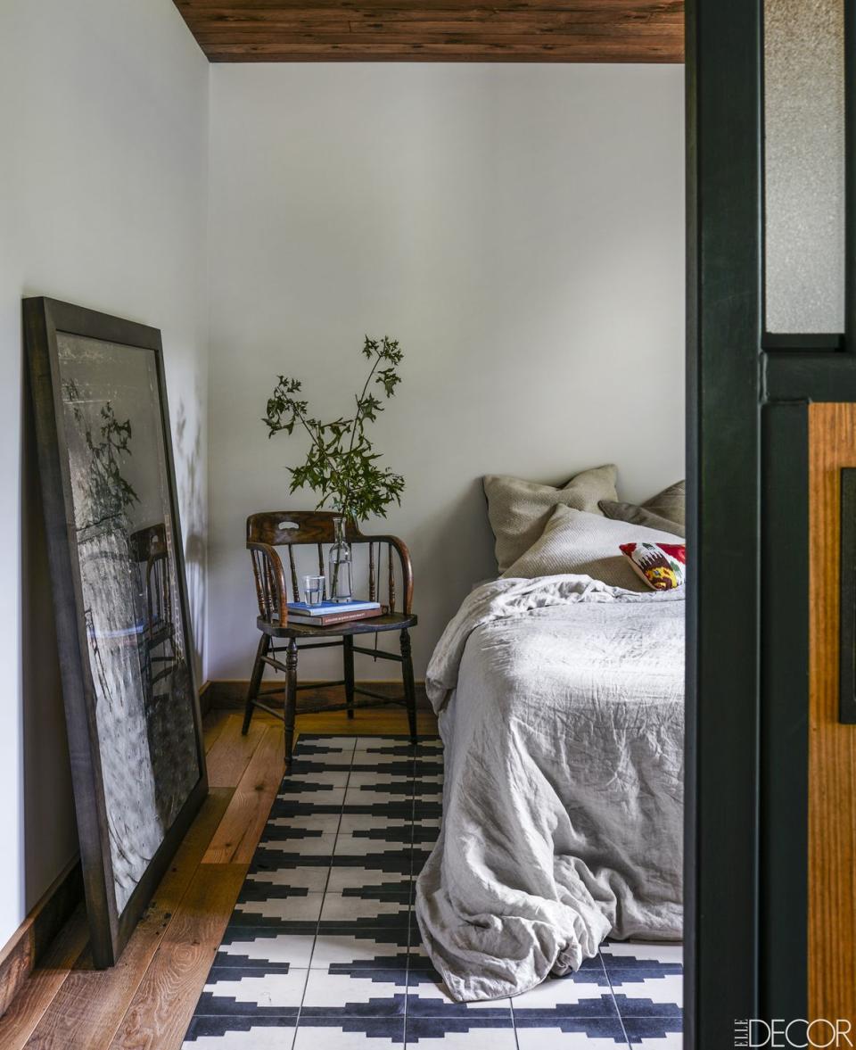 amanda seyfried boho bedroom with cement tiles embedded into the floors