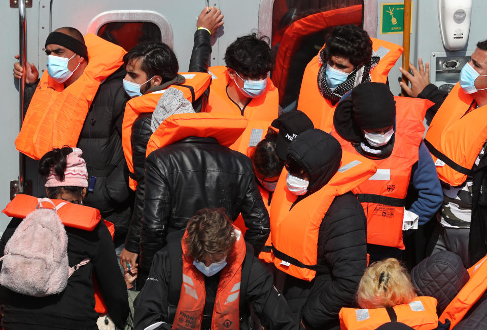 <p>A group of people thought to be migrants are brought in to Dover, Kent, following a small boat incident in the Channel earlier this morning. Picture date: Thursday June 3, 2021.</p>
