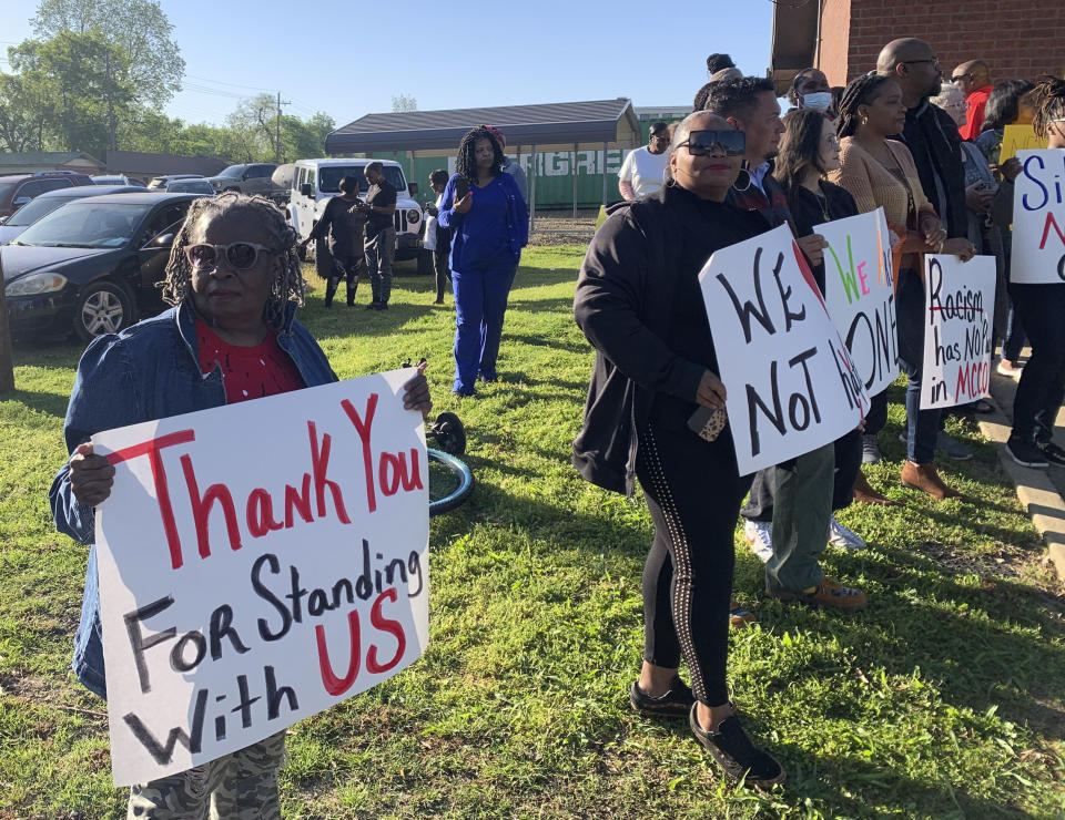 Glenda Austin of Idabel, Okla., holds a sign