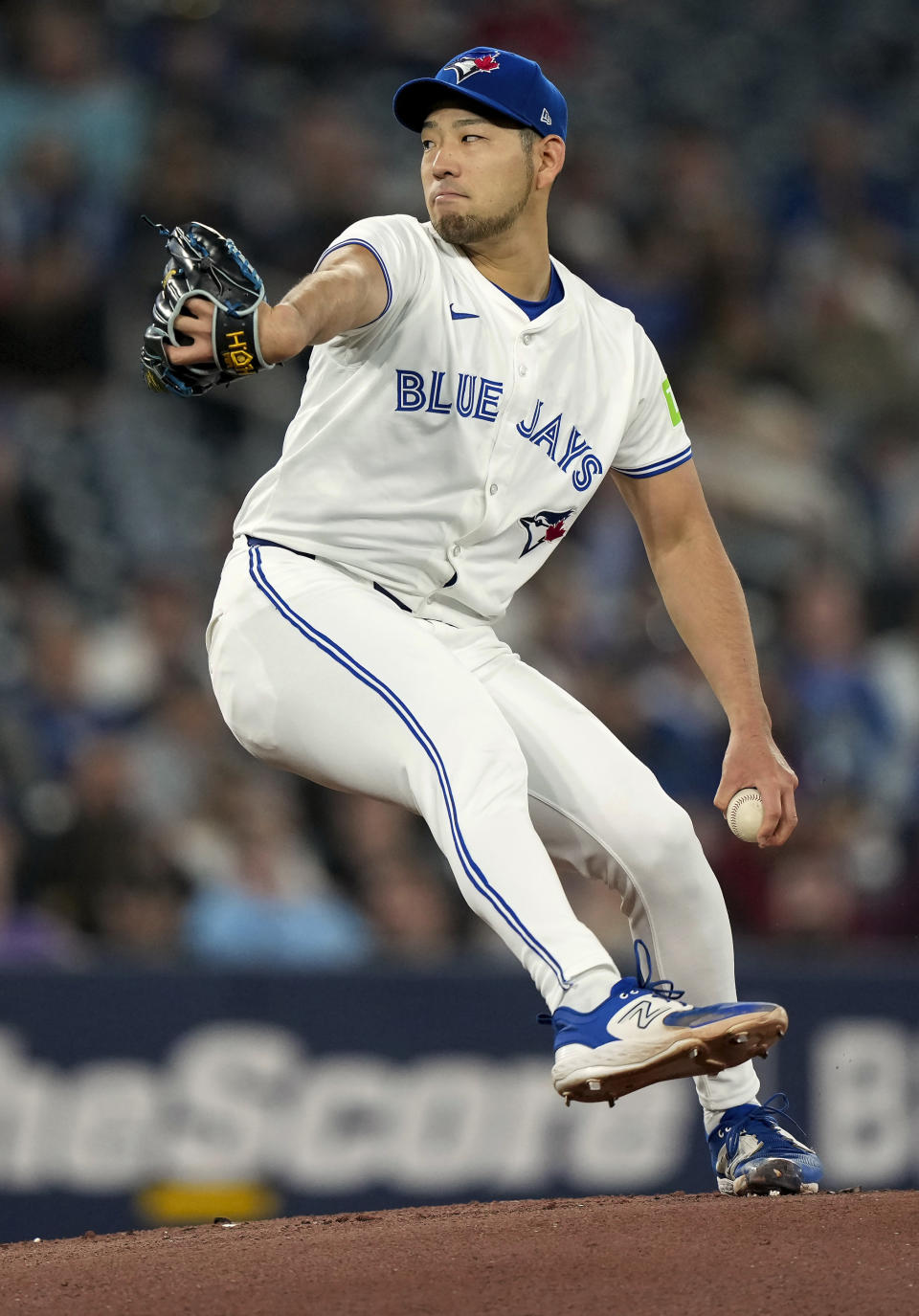 Toronto Blue Jays pitcher Yusei Kikuchi works against the Seattle Mariners during first inning of a baseball game in Toronto, Wednesday, April 10, 2024. (Nathan Denette/The Canadian Press via AP)