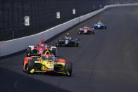 Delvin Defrancesco leads a group of cars into Turn 1 during testing at Indianapolis Motor Speedway, Thursday, April 21, 2022, in Indianapolis. (AP Photo/Darron Cummings)