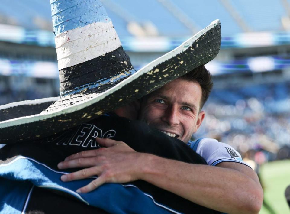 Charlotte FC midfielder Brandt Bronico, right, hugs a fan after a win against the Atlanta United at the Bank of America Stadium in Charlotte, N.C., on Sunday, April 10, 2022. Khadejeh Nikouyeh/Knikouyeh@charlotteobserver.com