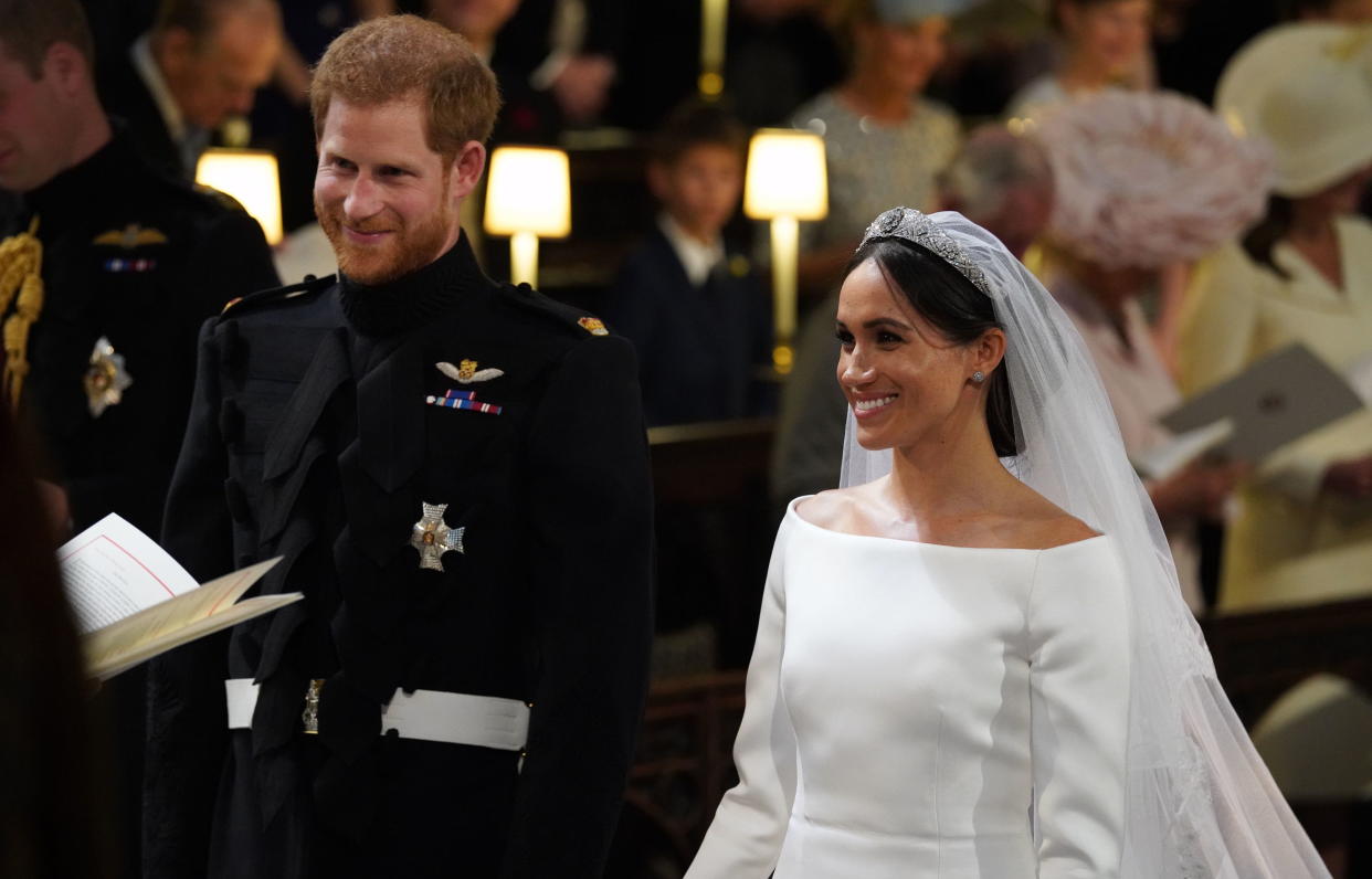 The Duchess of Sussex even tied the knot with her hair in a low wispy bun (tendrils and all) [Photo: Getty]