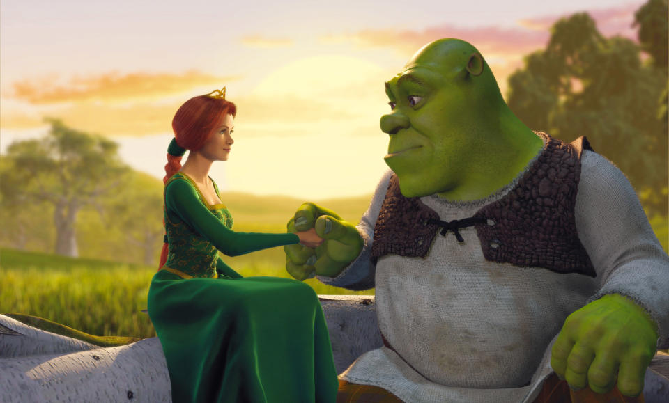 Princess Fiona and Shrek from the movie Shrek are sitting on a rock, holding hands and looking at each other against a sunset background