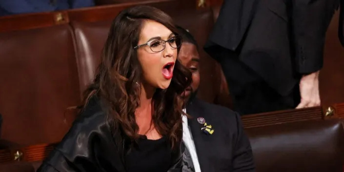 U.S. Rep. Lauren Boebert (R-CO) and Rep. Marjorie Taylor Greene (R-GA) scream "Build the Wall" at President Joe Biden during Biden's State of the Union address to a joint session of the U.S. Congress in the House of Representatives Chamber at the Capitol in Washington, U.S. March 1, 2022.