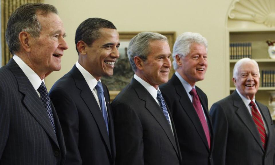George HW Bush, Barack Obama, George Bush, Bill Clinton and Jimmy Carter pose together in 2009.