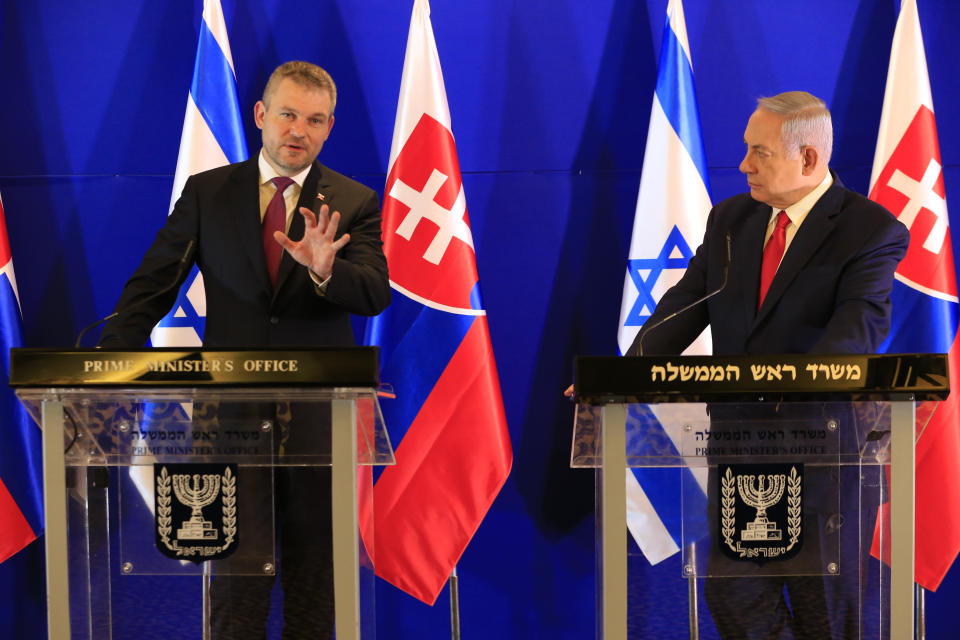 Slovakia's Prime Minister Peter Pellegrini, left, speaks as Israeli Prime Minister Benjamin Netanyahu listens after their meeting in Jerusalem, Tuesday, Feb. 19, 2019. (AP Photo/Ariel Schalit, Pool)