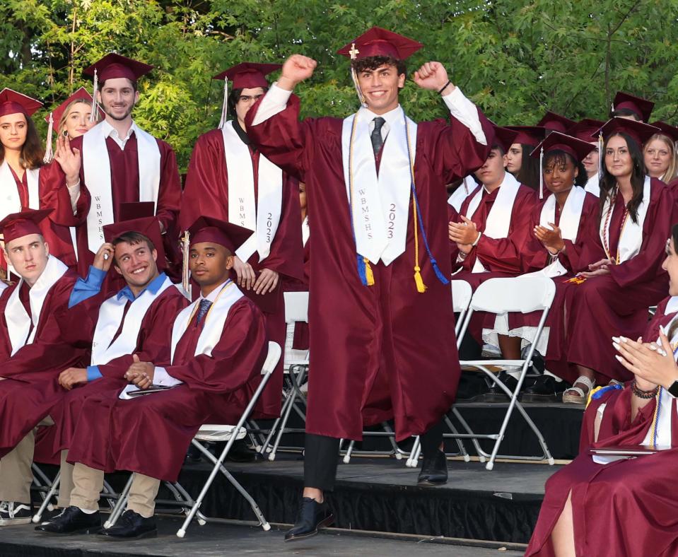 Will DeLuca celebrates as he receives his diploma during the West Bridgewater Middle-Senior High School graduation at War Memorial Park on Friday, May 26, 2023. 