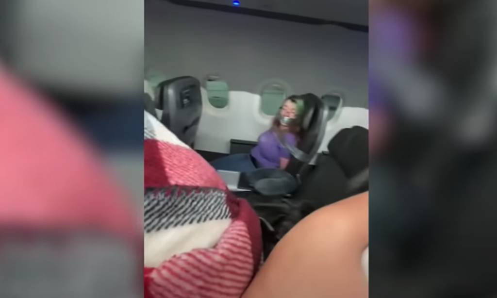 Video posted to TikTok showed an American Airlines passenger duct-taped to her seat after she allegedly attacked crew members (tiktok)