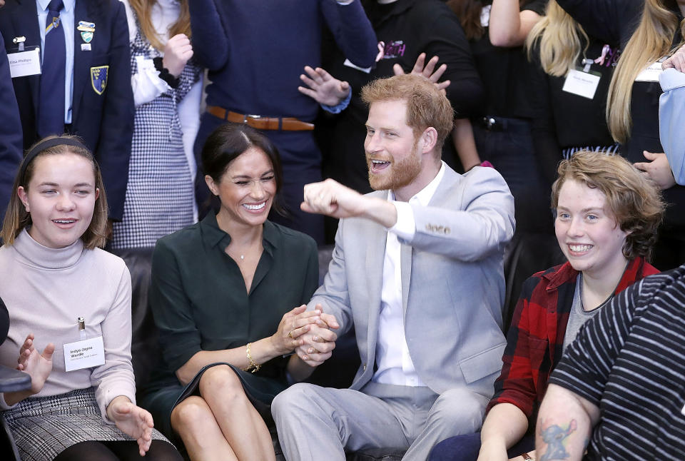 Meghan Markle and Prince Harry couldn’t keep their hands off each other as they visited Sussex yesterday. Photo: Getty Images