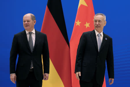 German Finance Minister Olaf Scholz, left, and Chinese Vice Premier Liu He arrive for the China-Germany High Level Financial Dialogue at the Diaoyutai State Guesthouse in Beijing, Friday, Jan. 18, 2019. Andy Wong/Pool via Reuters