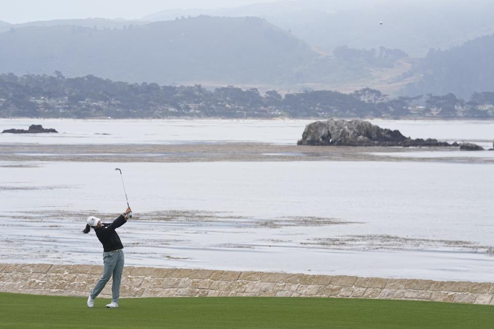 Ruoning Yin, of China, hits to the 18th green during a practice round for the U.S. Women's Open golf tournament at the Pebble Beach Golf Links, Tuesday, July 4, 2023, in Pebble Beach, Calif. (AP Photo/Darron Cummings)