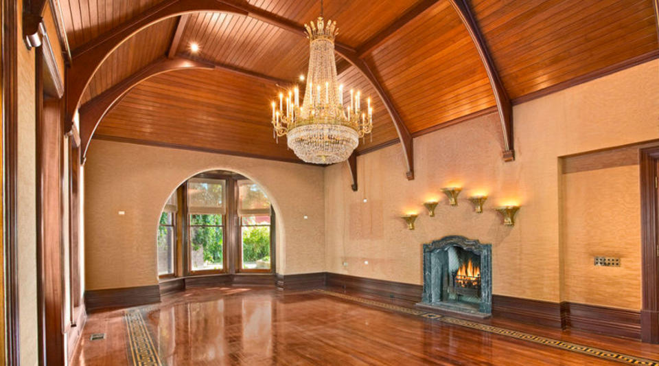 A ballroom with a chandelier.