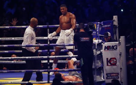 Britain Boxing - Anthony Joshua v Wladimir Klitschko IBF, IBO & WBA Super World Heavyweight Title's - Wembley Stadium, London, England - 29/4/17 Wladimir Klitschko is knocked down by Anthony Joshua Action Images via Reuters / Peter Cziborra Livepic