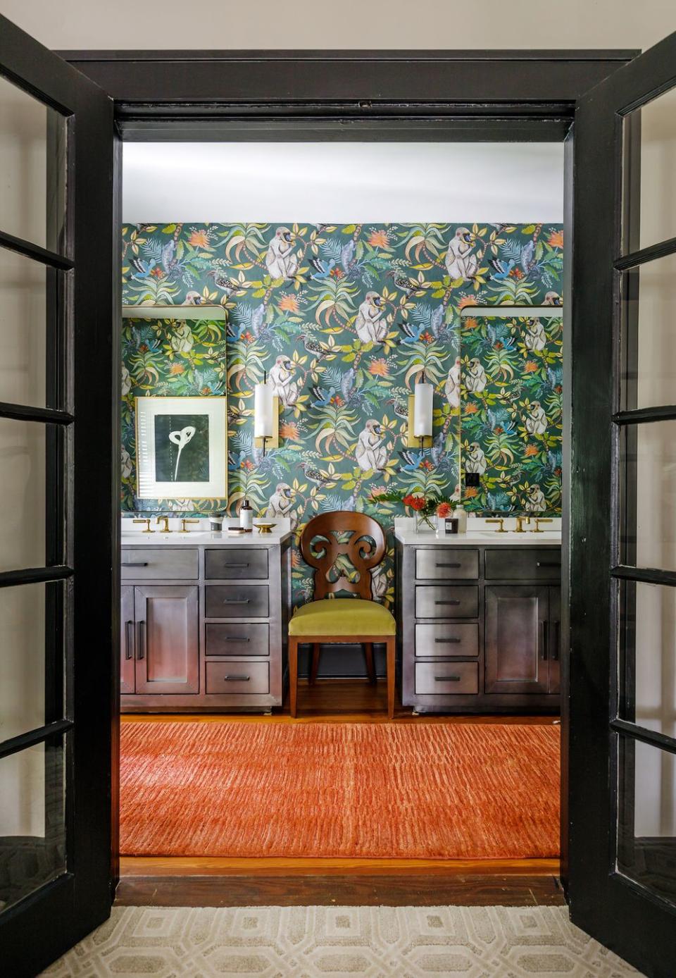 <p>Every room in designer Fitz Pullins's Florida home is bursting with fun, including this bathroom with cheeky monkey-print wallpaper. “What’s more invigorating than a jungle?” Pullins says. “Waking up, brushing your teeth—I want it to be entertaining for me.”</p>