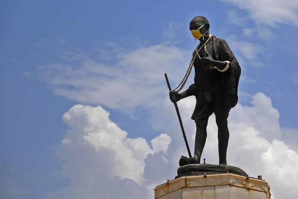 A mask is placed on a statue of Mahatma Gandhi to spread awareness against coronavirus, during the ongoing COVID-19 lockdown, at Gandhi Circle in Jaipur,Rajasthan,India, Monday, June 08, 2020.(Photo by Vishal Bhatnagar/NurPhoto via Getty Images)