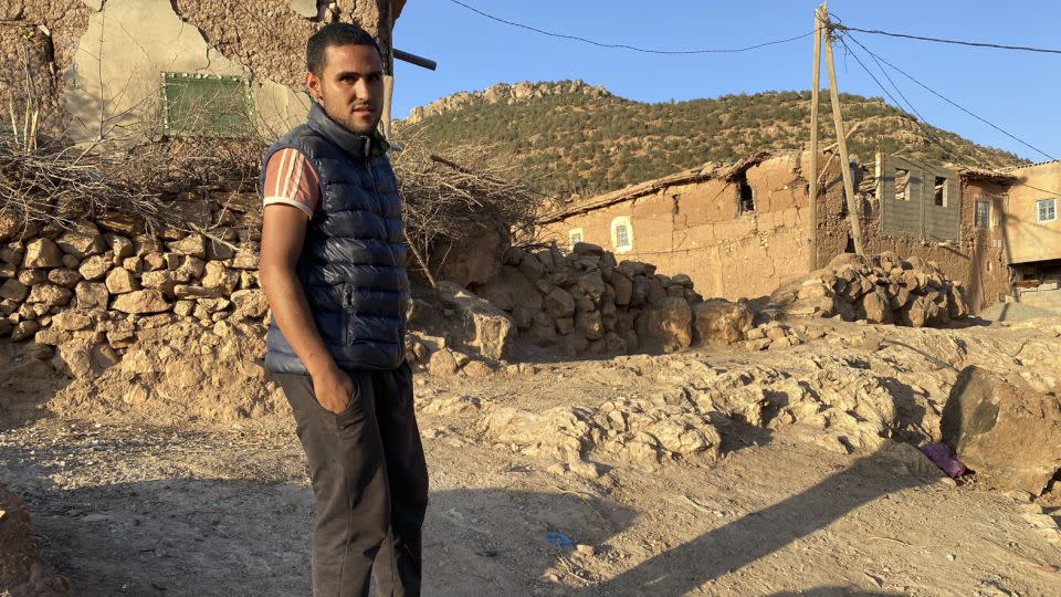 Hakim Idlhousein stands near the rubble of his house, in the village of Tinzert, in Morocco, which was destroyed by the quake. - Ivana Kottasova/CNN