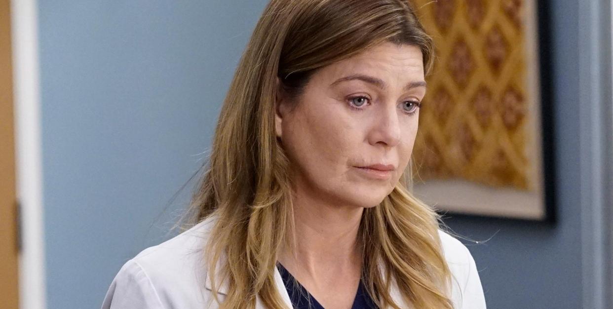 dr meredith grey in medical coat looking concerned