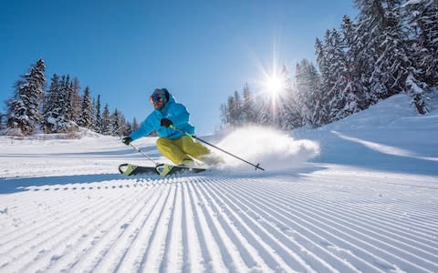 Skier in powder snow in Les Acrs - Credit: Tristan Shu