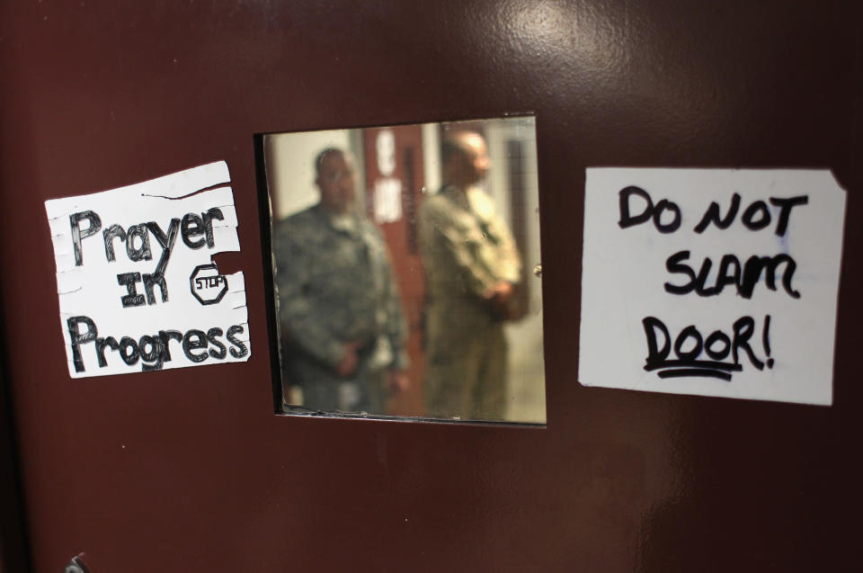 GUANTANAMO BAY, CUBA - SEPTEMBER 16: (EDITORS NOTE: Image has been reviewed by the U.S. Military prior to transmission.) U.S. soldiers stand guard inside the maximum security section of the U.S. detention center for "enemy combatants" on September 16, 2010 in Guantanamo Bay, Cuba. With attempts by the Obama administration to close the facility stalled, some 170 detainees remain at the detention center, which was opened by the Bush administration after 9/11. The facility is run by Joint Task Force Guantanamo, located at the U.S. Naval Station at Guantanamo Bay on the southeastern coast of Cuba. (Photo by John Moore/Getty Images)