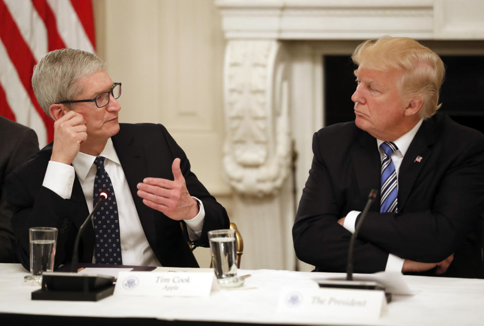 Tim Cook, CEO of Apple, speaks as President Donald Trump listens during an American Technology Council roundtable in the State Dinning Room of the White House, Monday, June 19, 2017. (AP Photo/Alex Brandon)