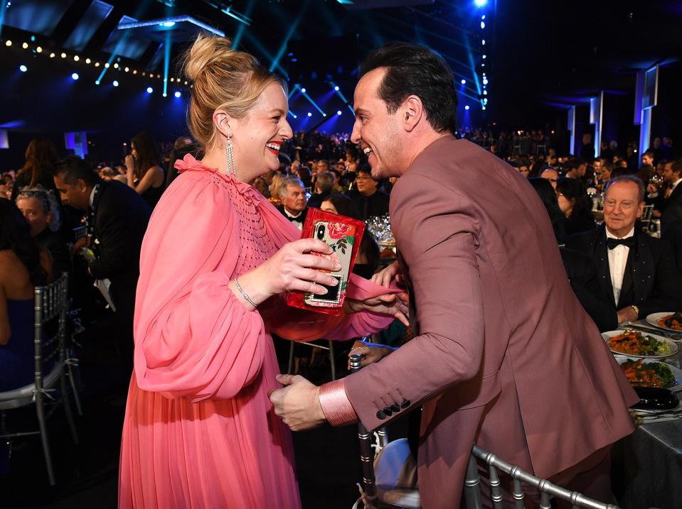 Elisabeth Moss and Andrew Scott looked delighted to see each other as she came over to give him a hug. (<a href="https://people.com/tv/sag-awards-2020-fleabag-andrew-scott-hot-priest-fan-interactions/" rel="nofollow noopener" target="_blank" data-ylk="slk:We're assuming she yelled "Hey, hot priest!".;elm:context_link;itc:0;sec:content-canvas" class="link ">We're assuming she yelled "Hey, hot priest!".</a>)