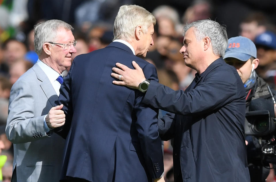 Sir Alex Ferguson, Arsene Wenger and Jose Mourinho share their moment before Arsenal’s last game at Manchester United under Wenger. (Getty)