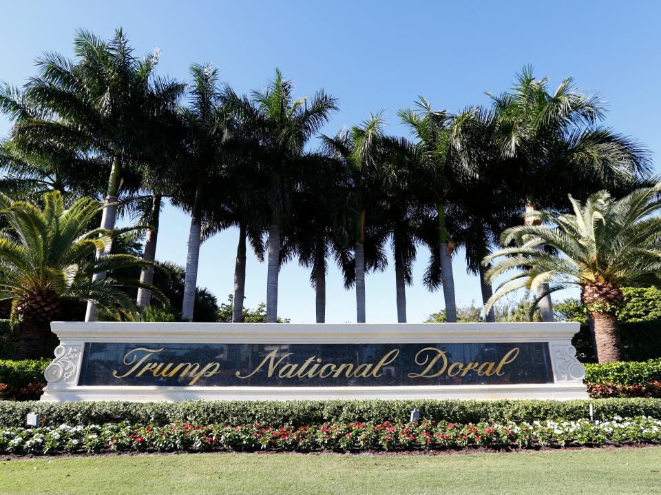 In this Nov. 20, 2019 photo, the entrance to the Trump National Doral resort is shown in Doral, Fla. The Trump golf resort in South Florida where President Donald Trump initially wanted to host this year's Group of Seven summit has temporarily laid off over 500 workers. (AP Photo/Wilfredo Lee)