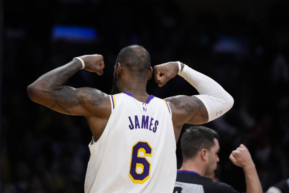 Los Angeles Lakers' LeBron James (6) flexes his arms after drawing a foul during the second half of an NBA basketball game against the Washington Wizards Sunday, Dec. 18, 2022, in Los Angeles. (AP Photo/Jae C. Hong)