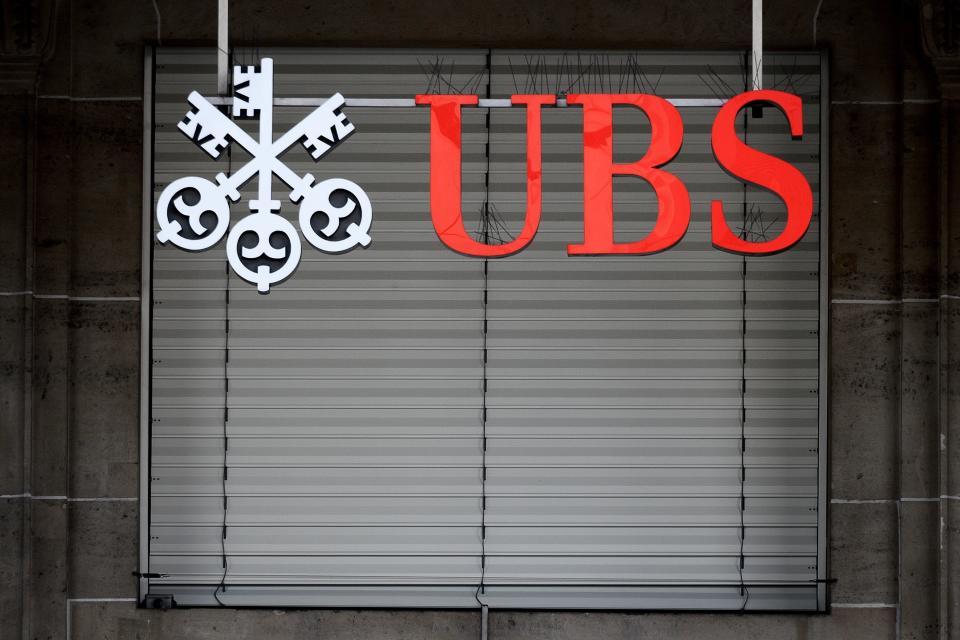 A sign of Swiss banking giant UBS is seen on October 6, 2018 at a branch in Lausanne. - Swiss banking giant UBS goes on trial over allegations it established a wide-ranging tax fraud scheme involving billions of euros on October 8, 2018 in Paris. (Photo by Fabrice COFFRINI / AFP)        (Photo credit should read FABRICE COFFRINI/AFP/Getty Images)