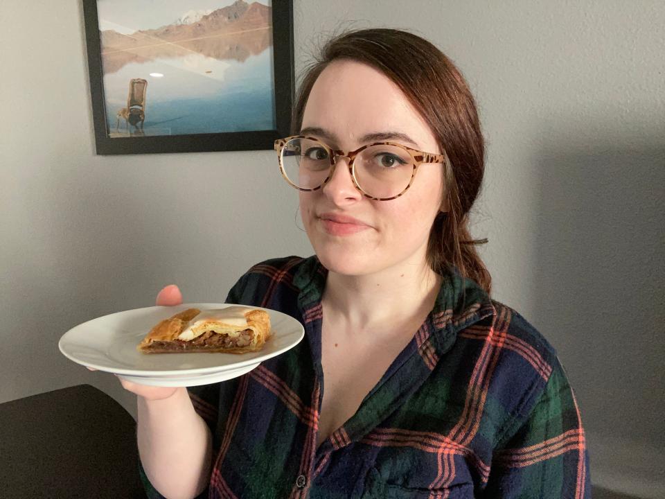 The writer holds a plate of a kringle from Trader Joe's