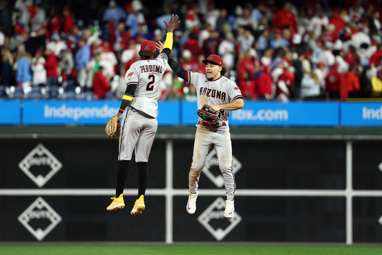 Geraldo Perdomo and Alek Thomas celebrate the win. (Elsa/Getty Images)