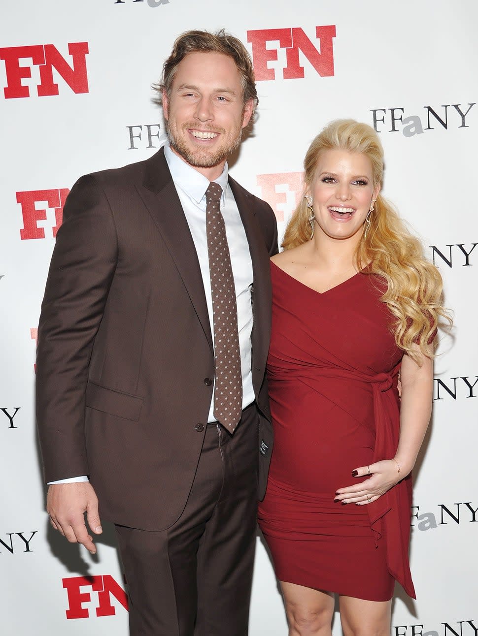 Former professional football player Eric Johnson (L) and recording artist/actress Jessica Simpson attend the 25th Annual Footwear News Achievement Awards at the Museum of Modern Art on November 29, 2011 in New York City. 