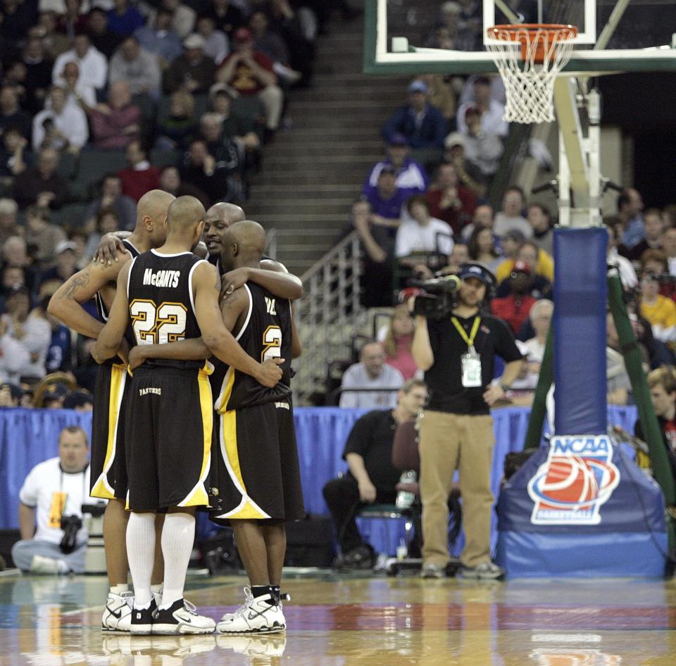 Ed McCants, Joah Tucker (facing camera) and teammates gather during a break in the action in their game against Boston College in Cleveland in the second round of the NCAA Tournament in 2005. UW-Milwaukee won, 83-75.