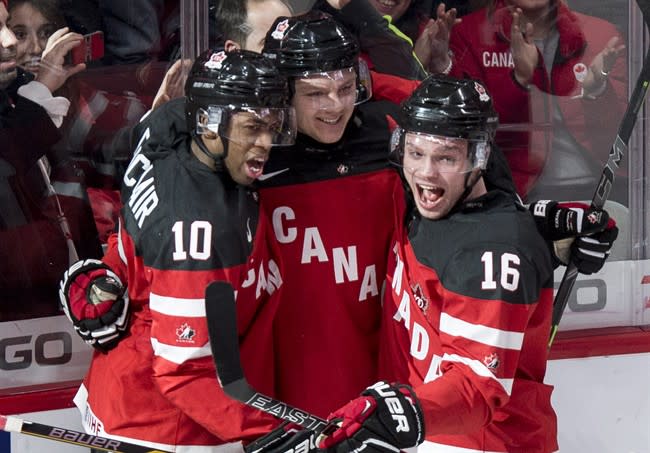 Anthony Duclair (from left), Sam Reinhart and Max Domi celebrate a goal on Monday (Paul Chiasson, The Canadian Press) 