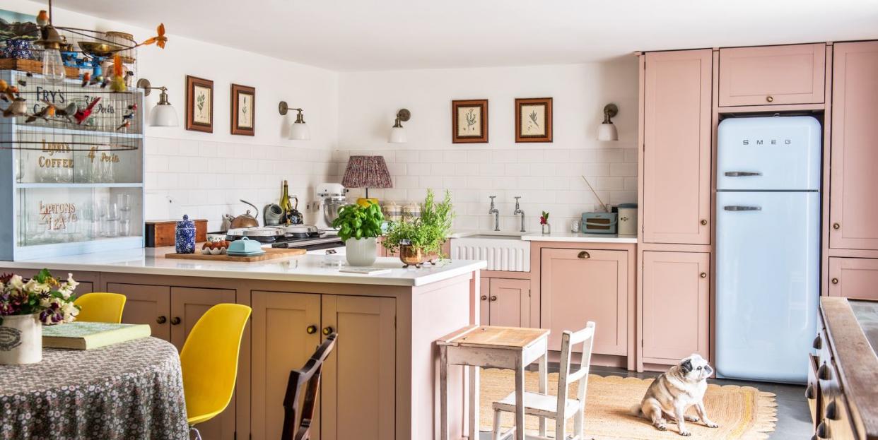 a pastel pink kitchen with quirky retro touches and kitsch vintage accessories