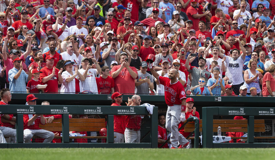 Los Angeles Angels' Albert Pujols waves to fans after getting a curtain call when he hit a home run during seventh inning of a baseball game against the St. Louis Cardinals, Saturday, June 22, 2019, in St. Louis. (AP Photo/L.G. Patterson)