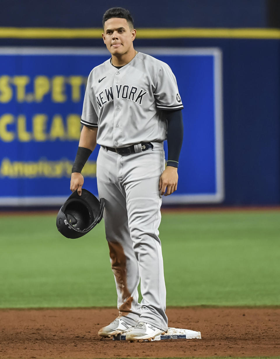 New York Yankees' Gio Urshela stands on second base after hitting a two-run double off Tampa Bay Rays starter Shane McClanahan during the fifth inning of a baseball game Tuesday, July 27, 2021, in St. Petersburg, Fla. (AP Photo/Steve Nesius)