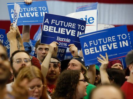 Supporters of Democratic U.S. presidential candidate and U.S. Senator Bernie Sanders cheer as they await his arrival during his five state primary night rally held in Huntington, West Virginia, U.S., April 26, 2016. REUTERS/Marcus Constantino