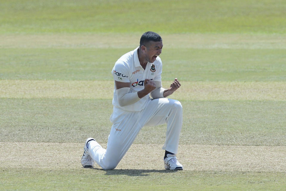 Bangladeshi bowler Taskin Ahmed, celebrates after dismissing Sri Lanka batsman Dimuth Karunaratne, during the fifth day of the first test cricket match between Sri Lanka and Bangladesh in Pallekele, Sri Lanka, Sunday, April 25, 2021. ( AP Photo/Sameera Peiris)